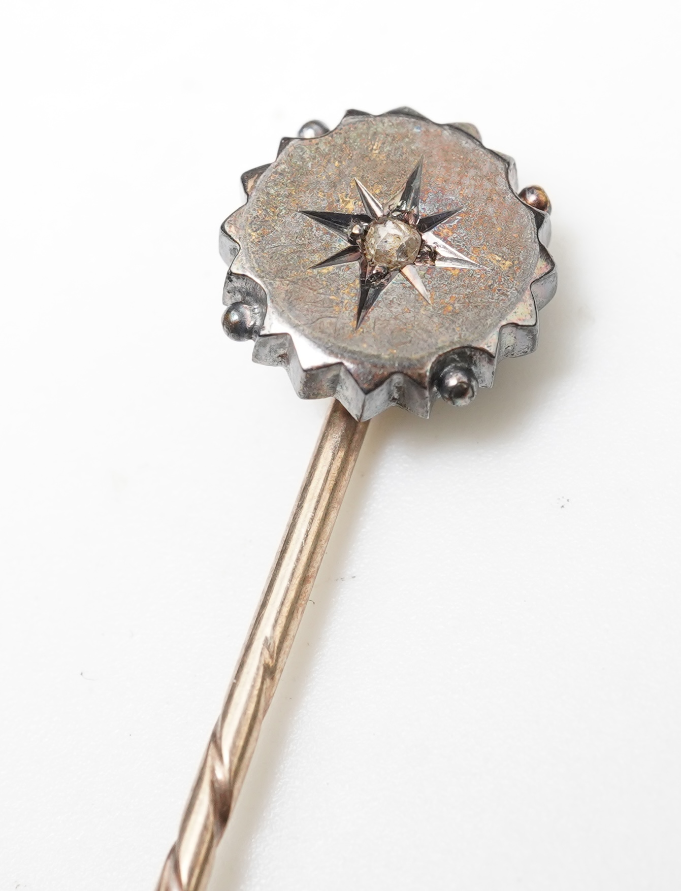 A bar brooch and a stick pin, late 19th/early 20th century